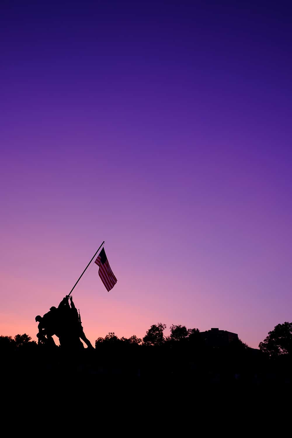 The Marine Corp memorial against a sunset sky